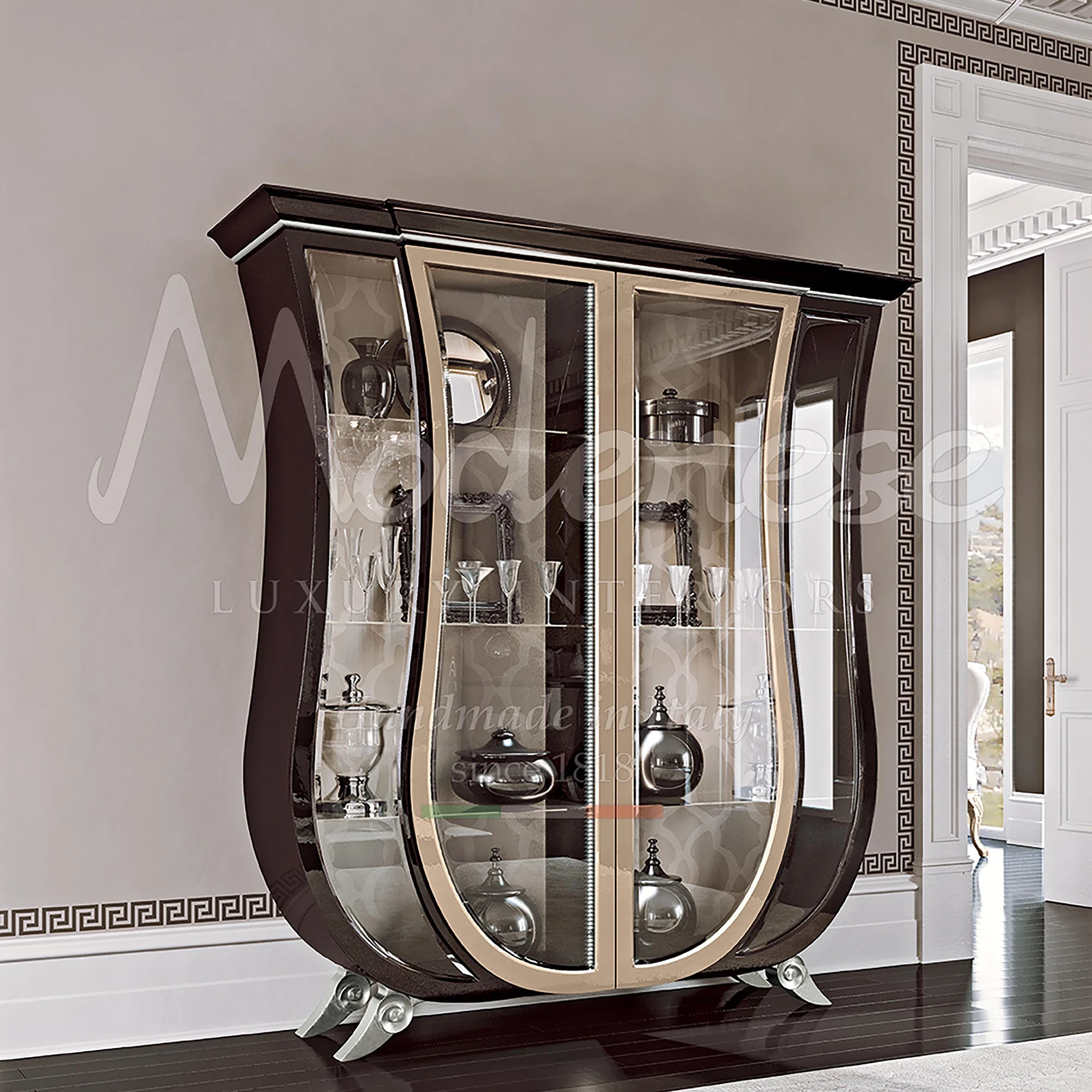 Featuring curved shaped lines, these glass cabinets created by Modenese exemplify high-end Italian design at its finest.